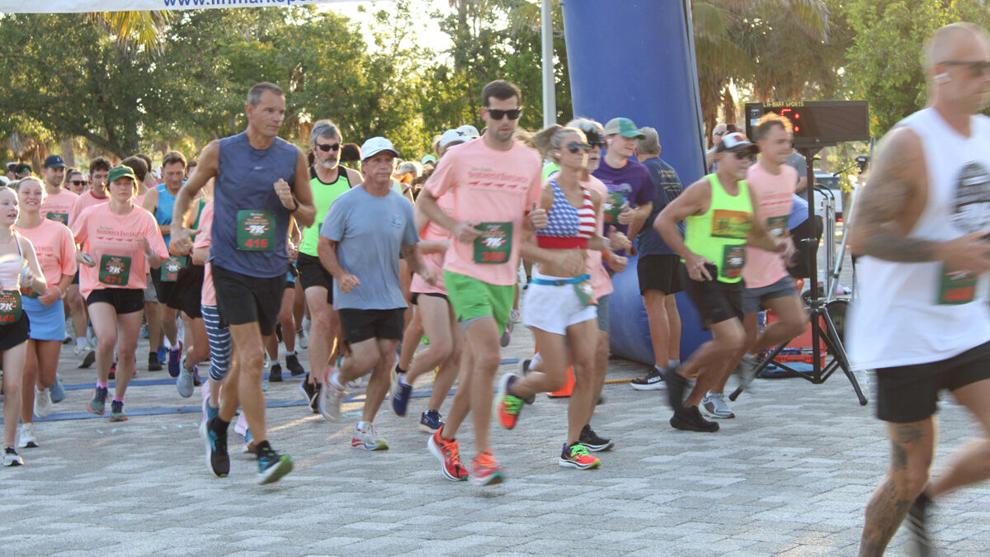 Participants running along the island route during the Sanibel 7K Charity Race.